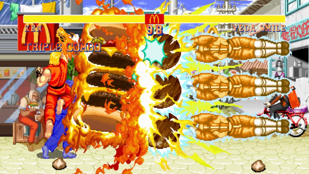 技を打ち合うケンとベガスマイル