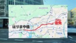 高知から徳島までの電車旅をするスーツ