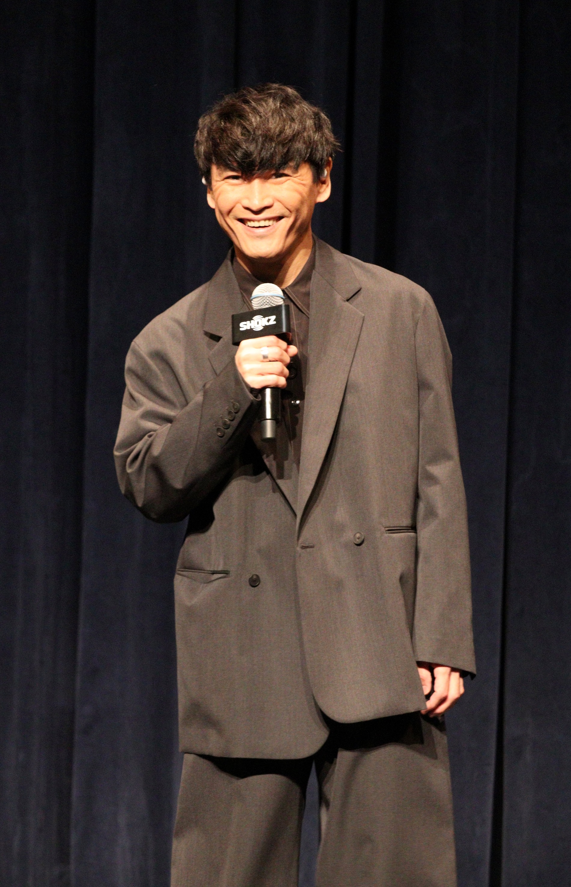 登壇する山口一郎